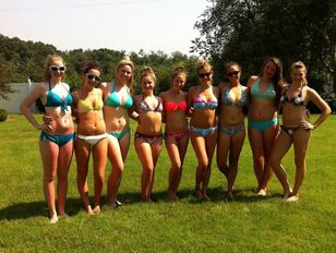 A group of young woman models posing in swimsuit First-timer