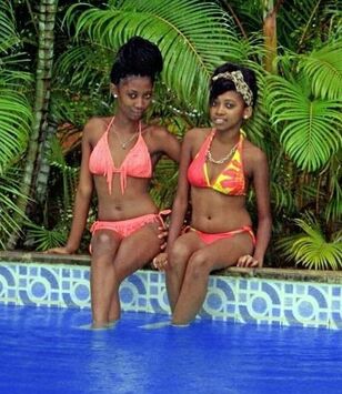 Beddable and young lady dark-hued cuties in wee wee bikinis