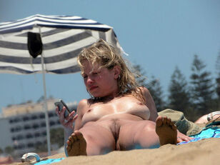 Huge-chested girlfriends naked on the beach